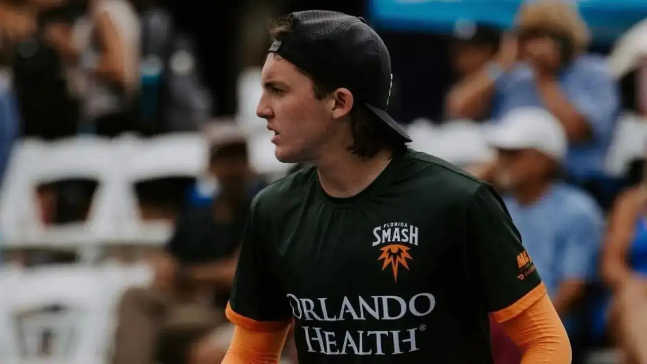 Cason Campbell in profile, Florida Smash jersey with Orlando Health sponsor and backwards black cap